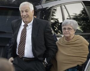 FILE - In this Dec. 13, 2011 file photo, former Penn State assistant football coach Jerry Sandusky arrives with his wife, Dottie Sandusky, for a preliminary hearing at the Centre County Courthouse in Bellefonte, Pa. Dottie Sandusky says it was long after hed been arrested, tried and convicted before she realized just how much trouble the former Penn State assistant football coach had gotten himself into. In an interview this week at her home in State College, Dottie Sandusky said that even after his 45-count guilty verdict in the child molestation case, she still had had hope. But when the judge gave him to 30 to 60 years in state prison, she said, she fully comprehended the trouble he was in. Shes been granting interviews in recent weeks, arguing her husbands conviction was unjust and claiming the victims who testified against him told inaccurate stories to cash in. An attorney involved in negotiating with Penn State on behalf of his victims calls her denials obscene. (AP Photo/Gene J. Puskar, File)